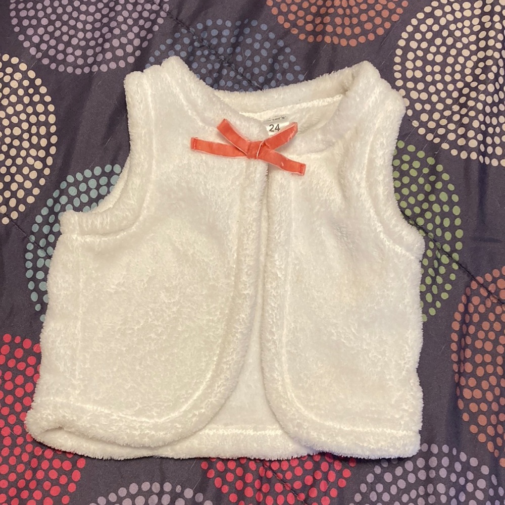 White vest with pink bow